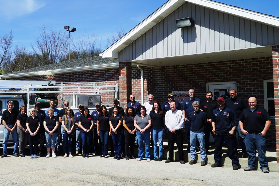 The Export Fuel Co. Inc. team standing in front of the building and work trucks.